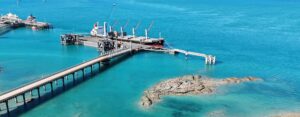 Aerial view of KMSB Terminal 2 floating wharf at the Port of Broome, with a bulk carrier alongside